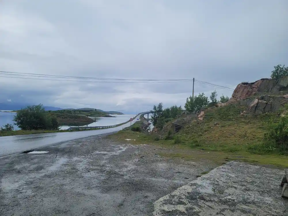 A causeway crossing shallow water to low ground