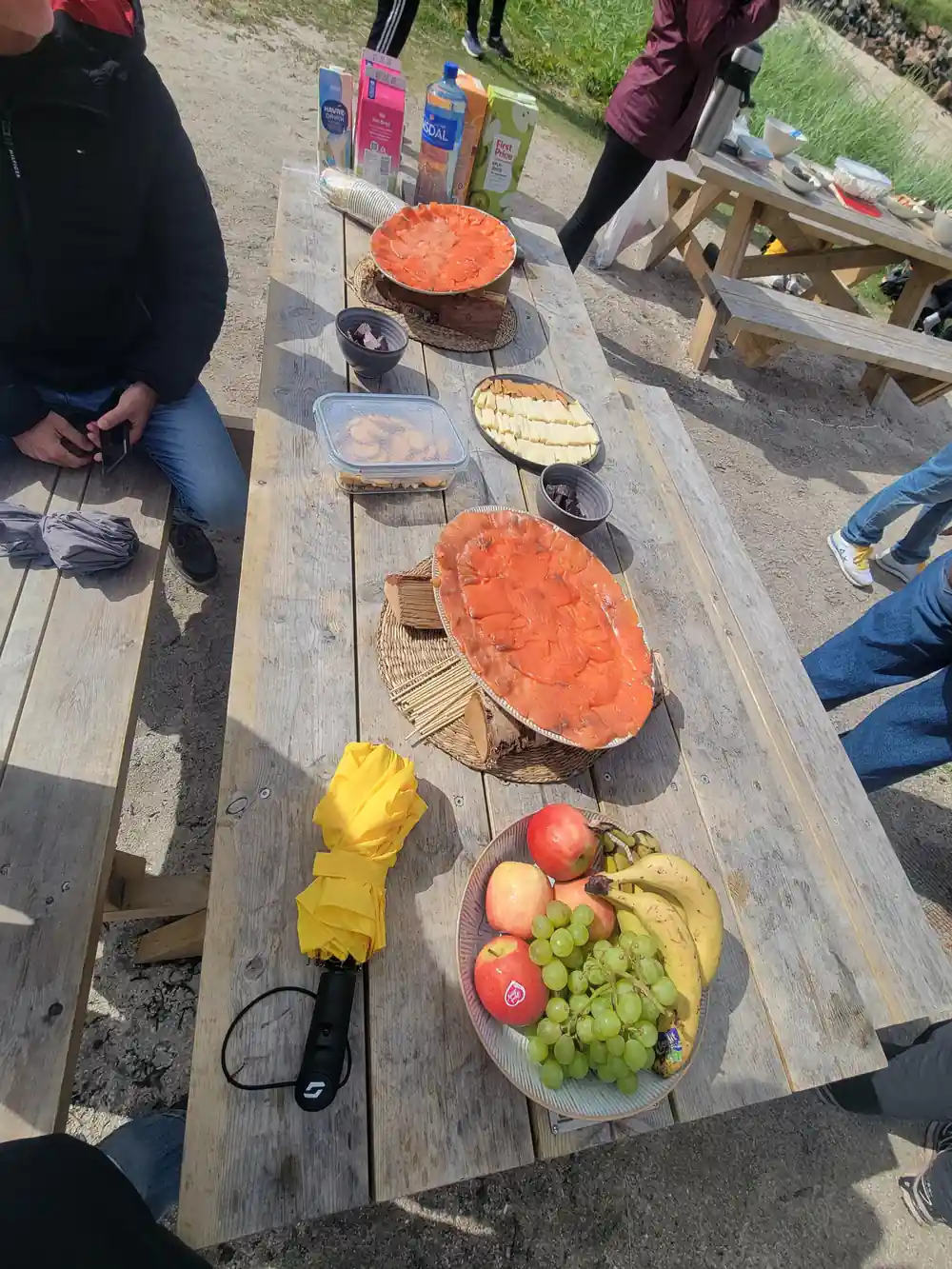 The full picnic spread laid along a wooden table