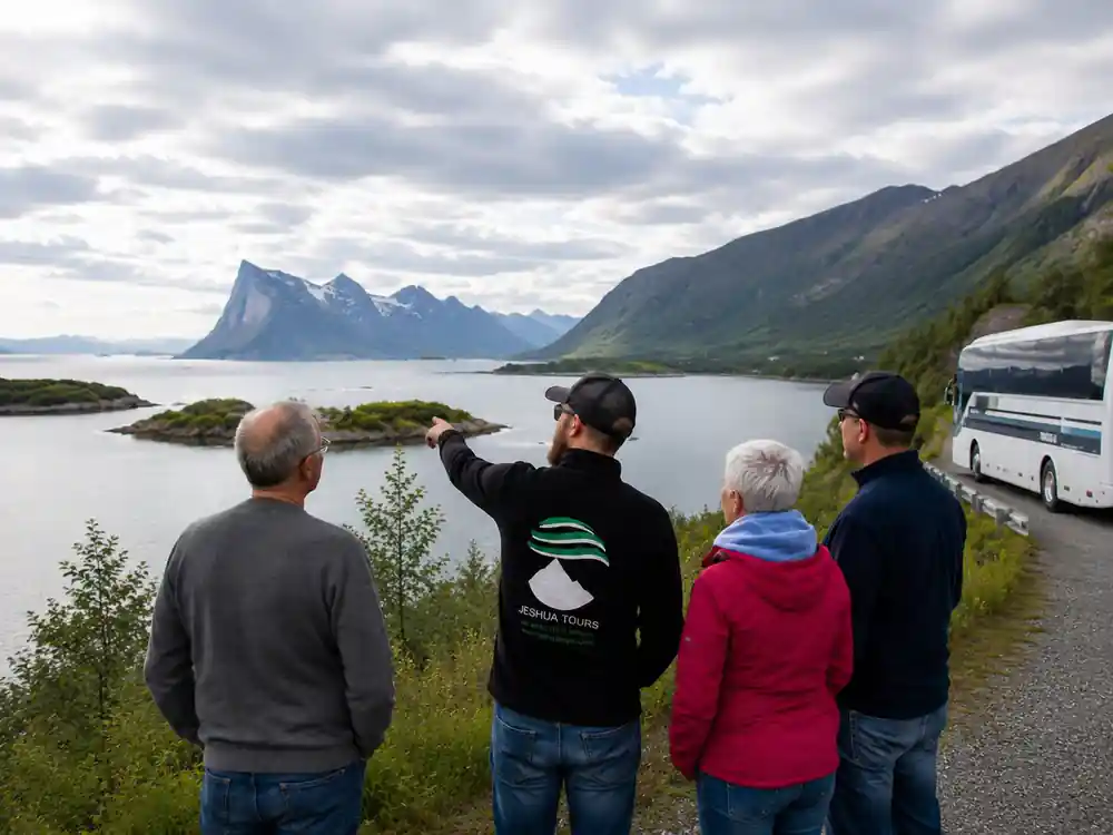 A guide pointing out the view to guests on a green headland
