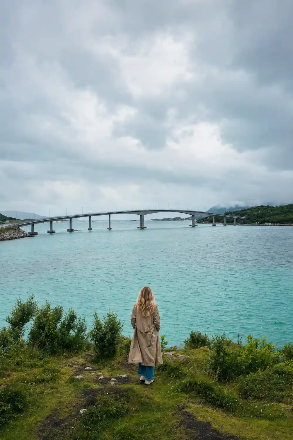 A long low bridge crossing pale turquoise water